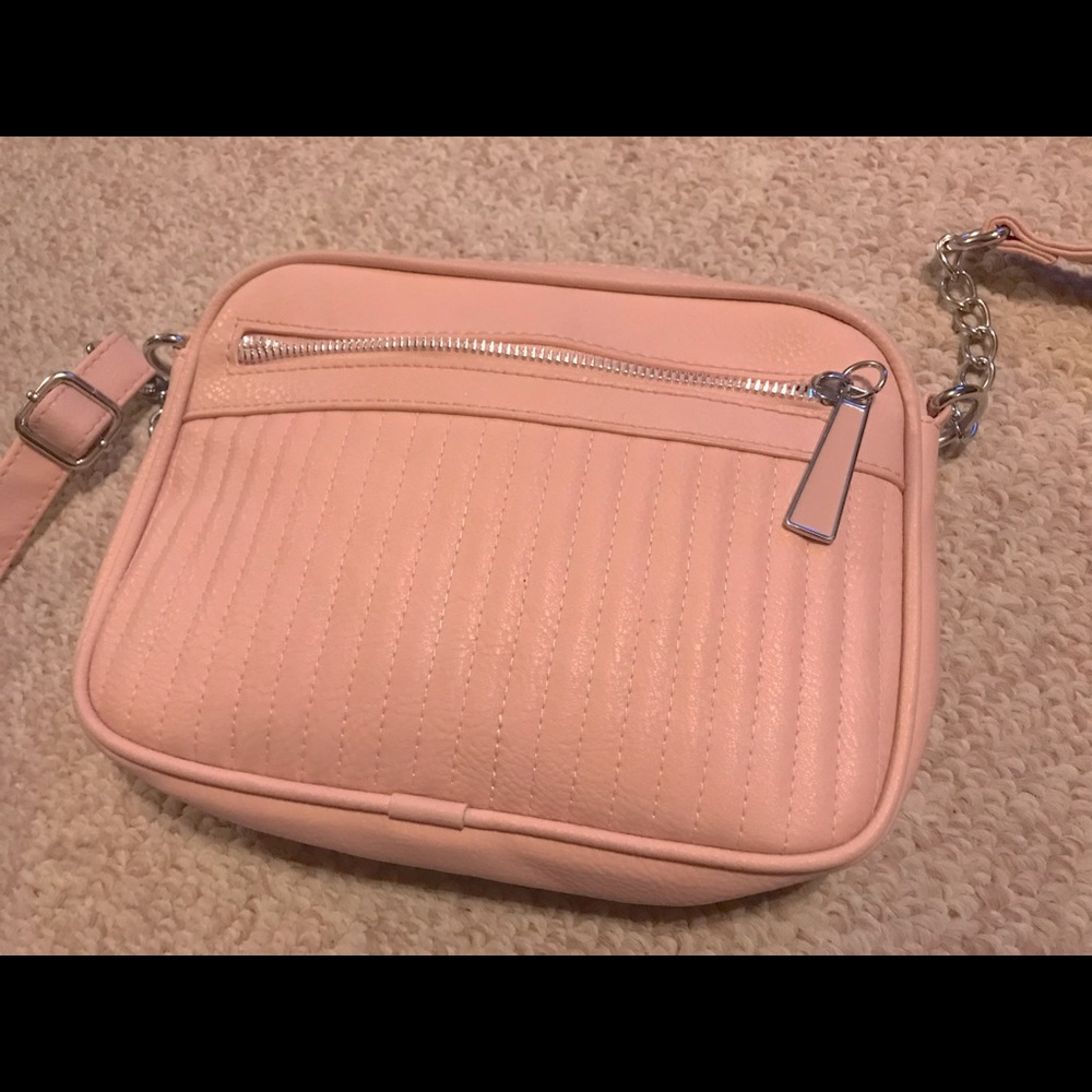 Pink purse with silver metal and pink matching strap